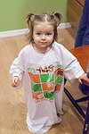 Getting ready to help Mommy make some Christmas cookies.  It's bound to get messy, so it's time for a big t-shirt.