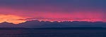 Sunset over the Olympic Mountains and the Puget Sound.  Alki Beach, WA.