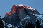 Alpenglow on Half Dome at sunset.  Yosemite National Park, CA.