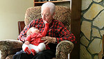 Great-grandpa holding Ellie.