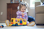 She has lots of fun with her school bus and all her people.