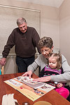 Putting stickers in her sticker book with Grammy and Gramps.  And Bob...