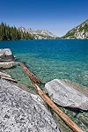 Turquoise and blue waters of Colchuck Lake on a warm sunny summer afternoon.  Cascade Mountains, WA.