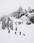 Steve, Kirsten, Brooke, and Charlie heading up below some frozen cliffs.