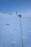 Steve took the lead as we started up the summit pyramid.  From a ways back, it had looked nearly vertical.  As we got closer, it looked steep, but not too bad.  The snow was still pretty hard, and we were the first ones to head up after some recent snow fall.  So we had to kick steps the whole way up.