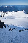 After I had collected all the pickets, I took the lead for the rest of the climb.  While Steve was removing an anchor, I took the opportunity to enjoy the view of the Sulphide Glacier and Baker Lake below us.  If you look hard, you can see Mt. Rainier (140 miles South) near the center of the horizon.