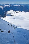 This is just after I got out of the steep chute onto the ridge just below the summit.  That's Brooke below me.  Glacier peak (left) and Mt. Rainier (right) are the two high points on the horizon.